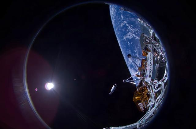 A fisheye view showing part of the NOVA-C lander with a portion of Earth in the background along with a Falcon 9 upper stage falling away