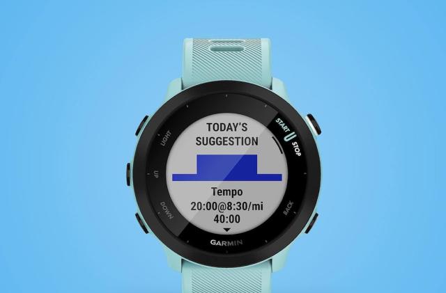 An aqua colored watch faces forward with a workout suggestion on its face. 