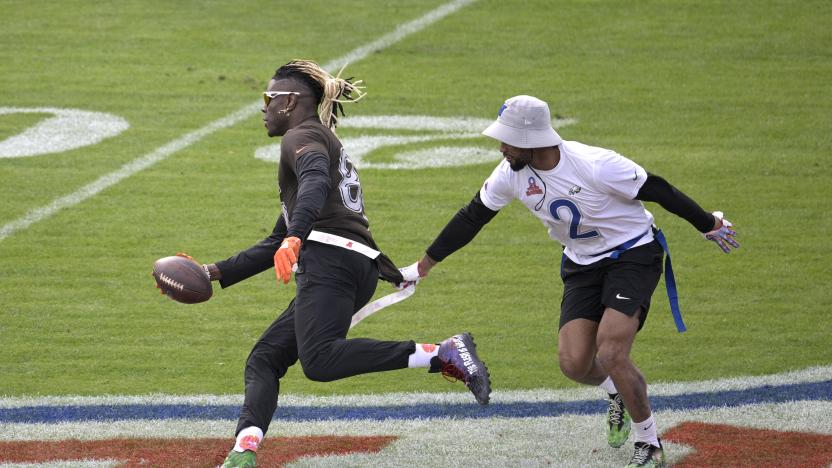 AFC tight end David Njoku (85), of the Cleveland Browns, runs after catching a pass as NFC defensive back Darius Slay (2) defends during the flag football event at the NFL Pro Bowl football game on Sunday, Feb. 4, 2024 in Orlando, Fla. (Phelan M. Ebenhack/AP Images for the NFL)