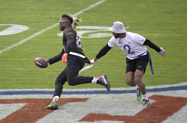AFC tight end David Njoku (85), of the Cleveland Browns, runs after catching a pass as NFC defensive back Darius Slay (2) defends during the flag football event at the NFL Pro Bowl football game on Sunday, Feb. 4, 2024 in Orlando, Fla. (Phelan M. Ebenhack/AP Images for the NFL)