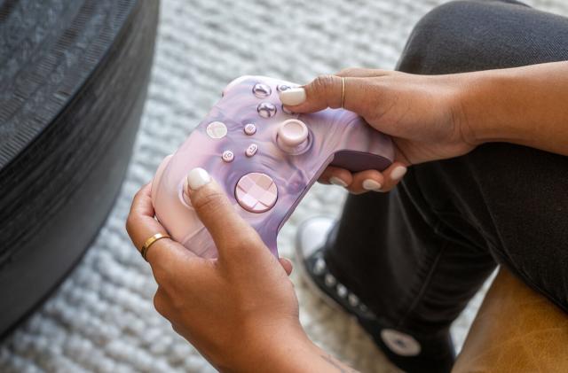 Xbox Dream Vapor controller with pink and purple swirls and buttons.