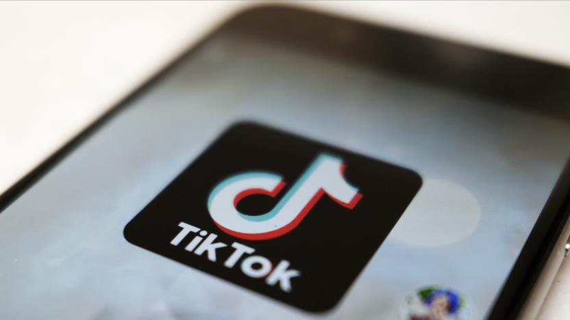 FILE - The TikTok logo is displayed on a smartphone screen, Sept. 28, 2020, in Tokyo, Japan. The European Union is looking into whether TikTok has broken the bloc’s strict new digital rules for cleaning up social media and keeping internet users safe. (AP Photo/Kiichiro Sato, File)