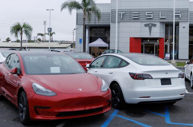 Tesla Model 3 vehicles are shown for sale at a Tesla facility in Long Beach, California, U.S., May 22, 2023. REUTERS/Mike Blake