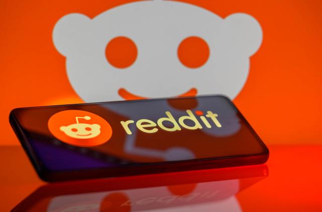 The Reddit logo is being displayed on a smartphone with the Reddit icon visible in the background in this photo illustration in Brussels, Belgium, on February 24, 2024. (Photo Illustration by Jonathan Raa/NurPhoto via Getty Images)