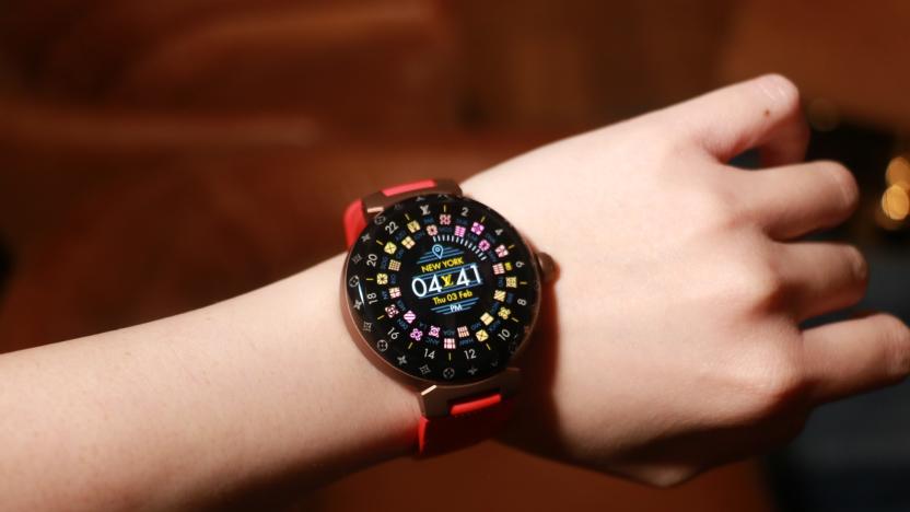 The Louis Vuitton Tambour Horizon Light Up smartwatch with a red rubber strap on a wrist. 