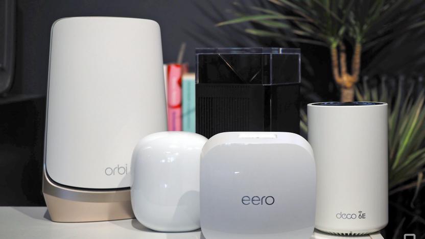 Family image of several WiFi routers including a Netgear Orbi, Nest WiFi Pro, Eero Pro, ZenWifi Pro and Deco XE75.