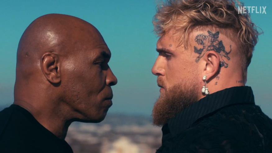 Mike Tyson and Jake Paul stand face to face.