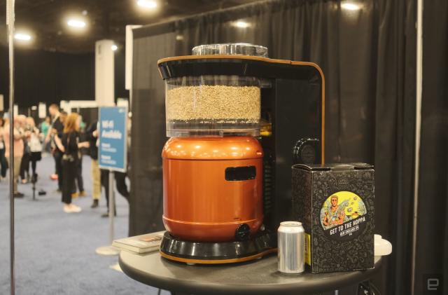 An Exobrew sitting on a messy table at CES Unveiled 2024 next to Get to the Hoppa beer.