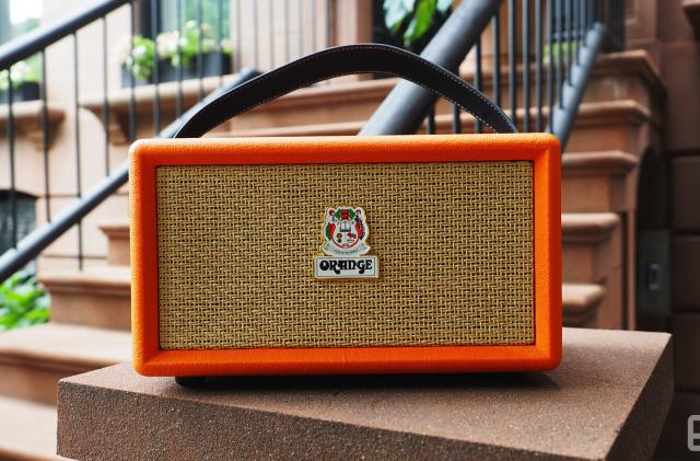 The Orange Amps - Orange Box Bluetooth speaker seen on the stoop of a brownstone, showing the front grille.