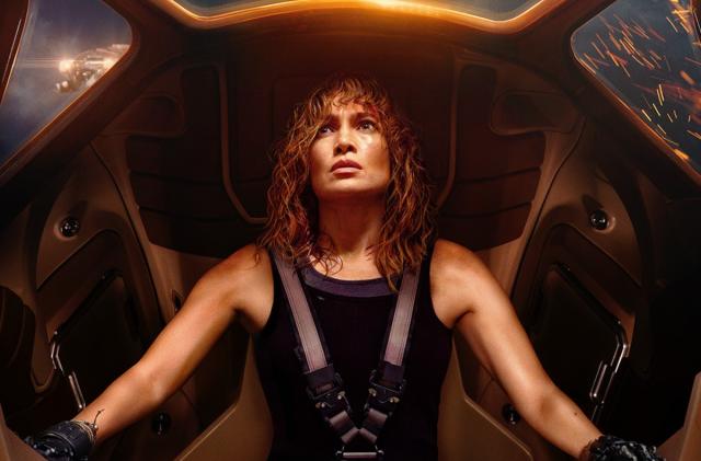 A woman (Jennifer Lopez) with a pensive expression sits inside a mech in Netflix movie Atlas.
