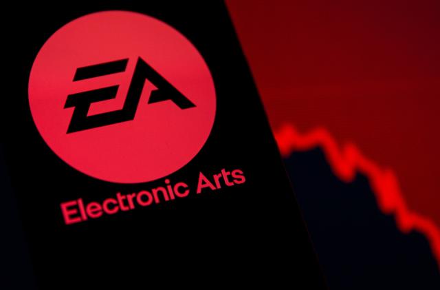 A smartphone with the Electronic Arts logo is seen in front of a displayed stock graph in this illustration taken September 16, 2021. REUTERS/Dado Ruvic/Illustration