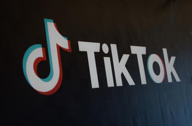 The logo of the social media video sharing app TikTok is seen during the launch of the TikTok and Indonesia's leading e-commerce site Tokopedia's Buy Local Campaign in Jakarta on December 12, 2023. Indonesia in September banned sales on social media to protect small businesses that were losing out to e-commerce giants, forcing TikTok to close its online shopping business in October. It is now set to resume that business in Indonesia -- one of TikTok's largest e-commerce markets -- under a deal with GoTo, which owns the popular local online shopping platform Tokopedia. (Photo by Yasuyoshi CHIBA / AFP) (Photo by YASUYOSHI CHIBA/AFP via Getty Images)
