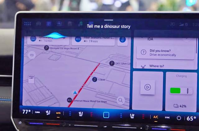 A Volkswagen in-dash tablet display shows an example of the ChatGPT integration announced at CES 2024.