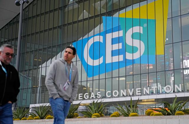 People walk by the Las Vegas Convention Center during setup ahead of the CES tech show Saturday, Jan. 6, 2024, in Las Vegas.